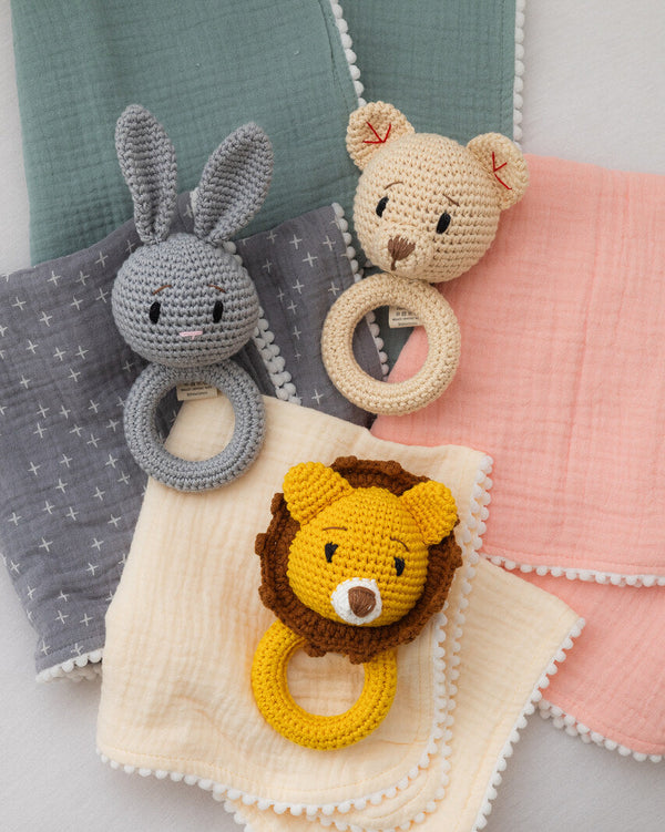 Barney and Bella organic cotton baby gift set with muslin squares and bibs in sage, cream, pink, grey, lion bunny bear rattle
