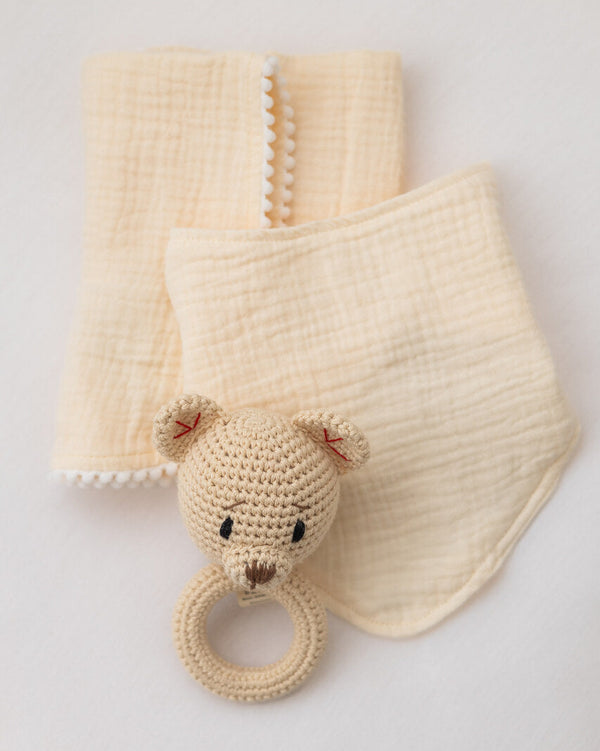 Barney and bella organic cotton cream muslin and bib baby gift set with barney bear crochet rattle.
