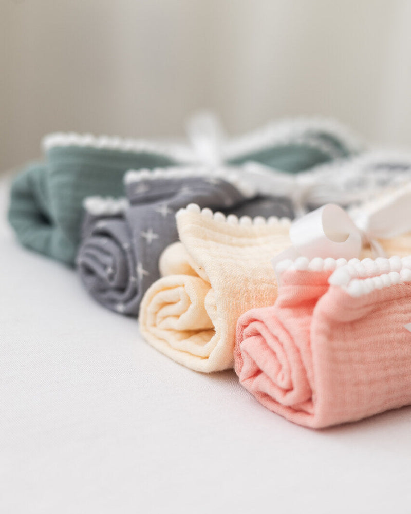 Barney and Bella organic cotton muslin squares baby gift set in sage green, cream, grey stars and pink.